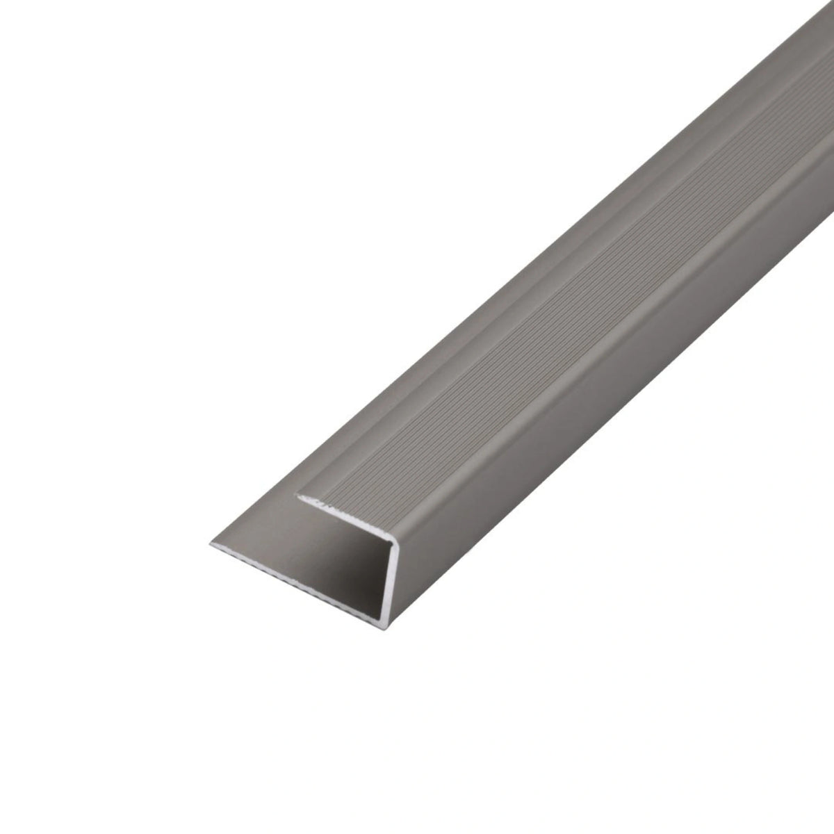 Titanium anodised end profile for inserting floor coverings with slight ribbing on the top.