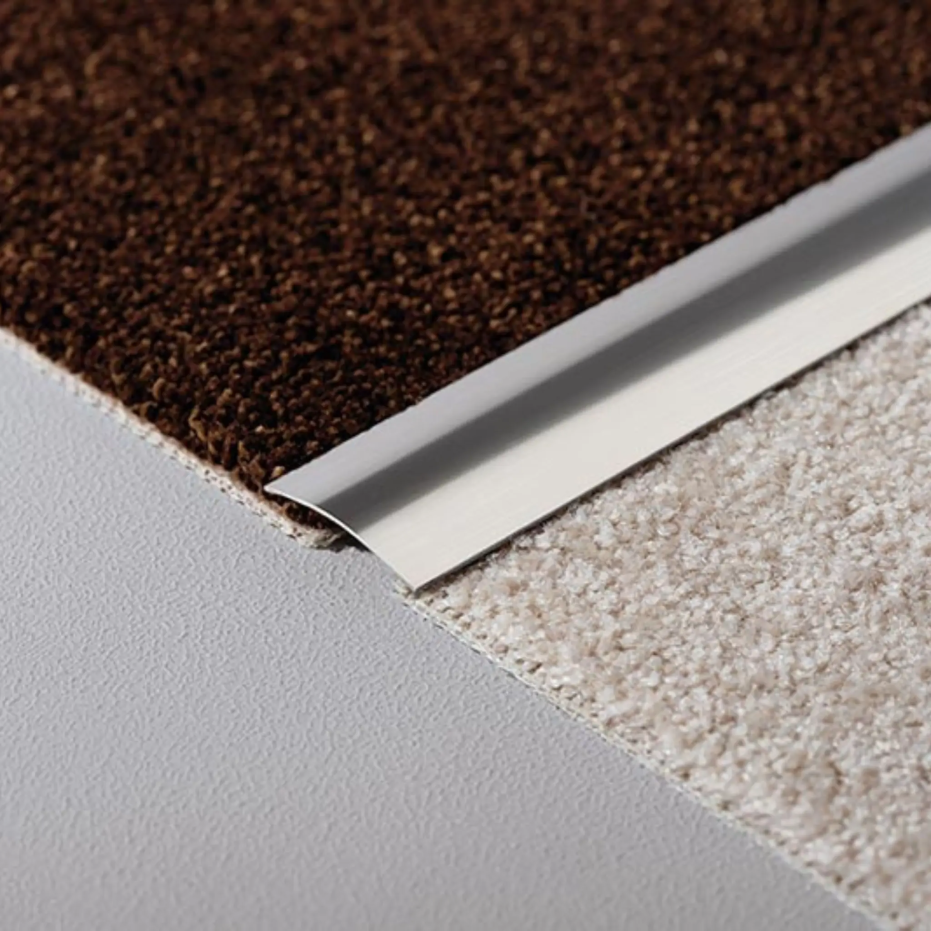 Lifestyle image transition profile stainless steel slightly curved between two carpets