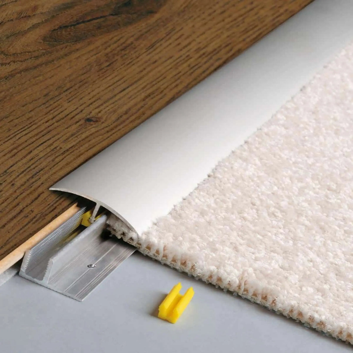 DURAL adaptation profile CLIPPER silver installed between 2 floor coverings