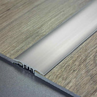 DURAL transition profile SNAP LVT silver installed between two parquet floors