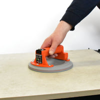 Lifestyle image person lifting a tile with the Battipav suction lifter